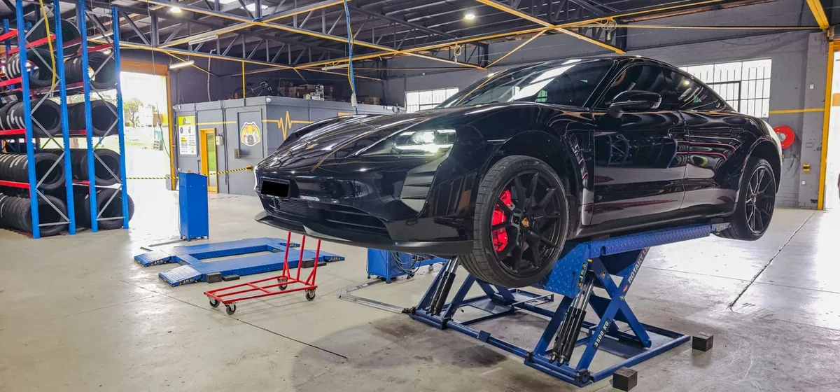 SUV on the hoist inside the Tyre Doctors workshop, Knoxfield