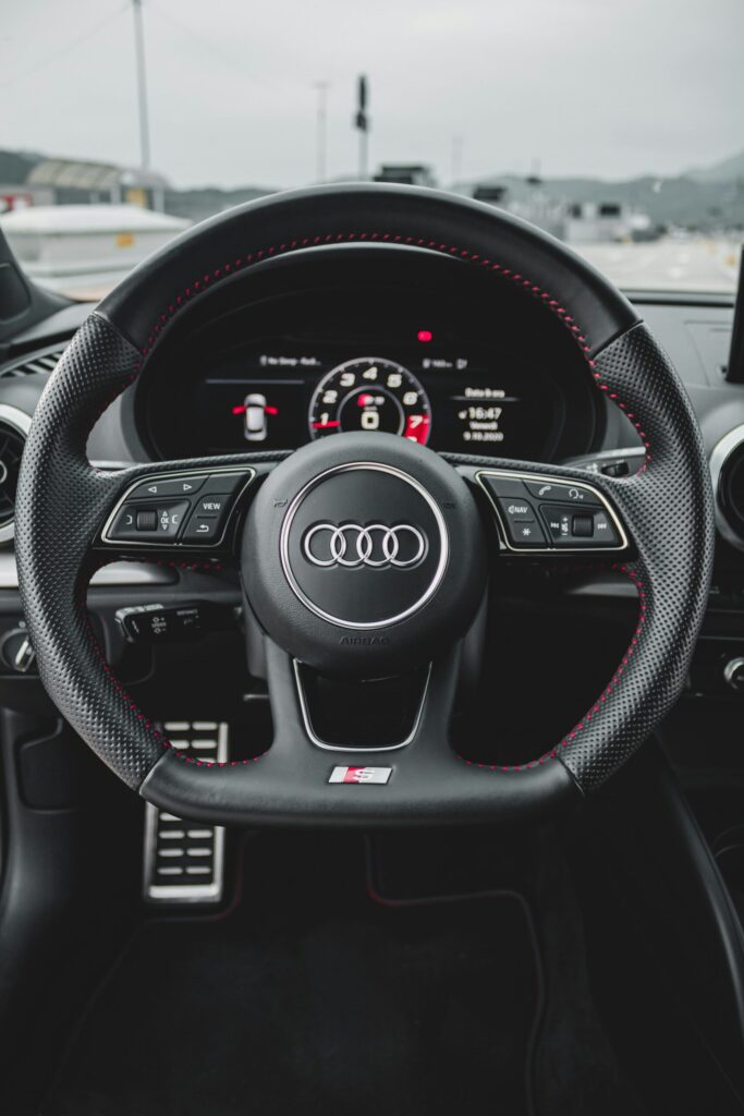 Hands on a steering wheel — diagnosing a car that pulls to one side