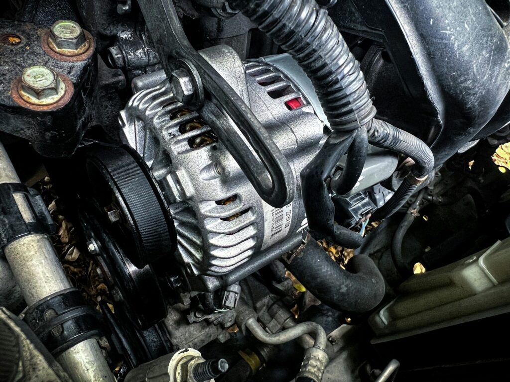 Car alternator in the engine bay — alternator repairs Melbourne at Tyre Doctors Knoxfield